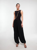 Black balloon trousers by MOSAÏKA styled with bodysuit standing pose