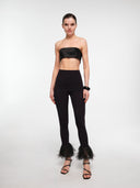 Black high-rise leggings by MOSAÏKA worn on model without trim