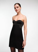 Black bustier mini dress by MOSAÏKA close-up front view on model