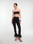 Black raffia trim leggings by MOSAÏKA worn on model front view