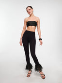 Black raffia trim leggings by MOSAÏKA worn on model full body view