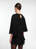 Black silk cape set by MOSAÏKA back angled view on model